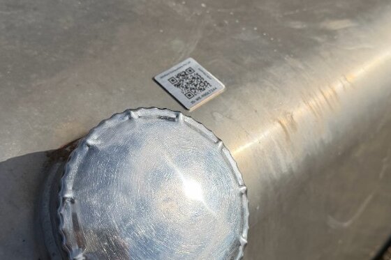 AXITRAQ QR code label applied to a fuel tank in the field